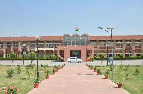 DCRUST University building with green lawns